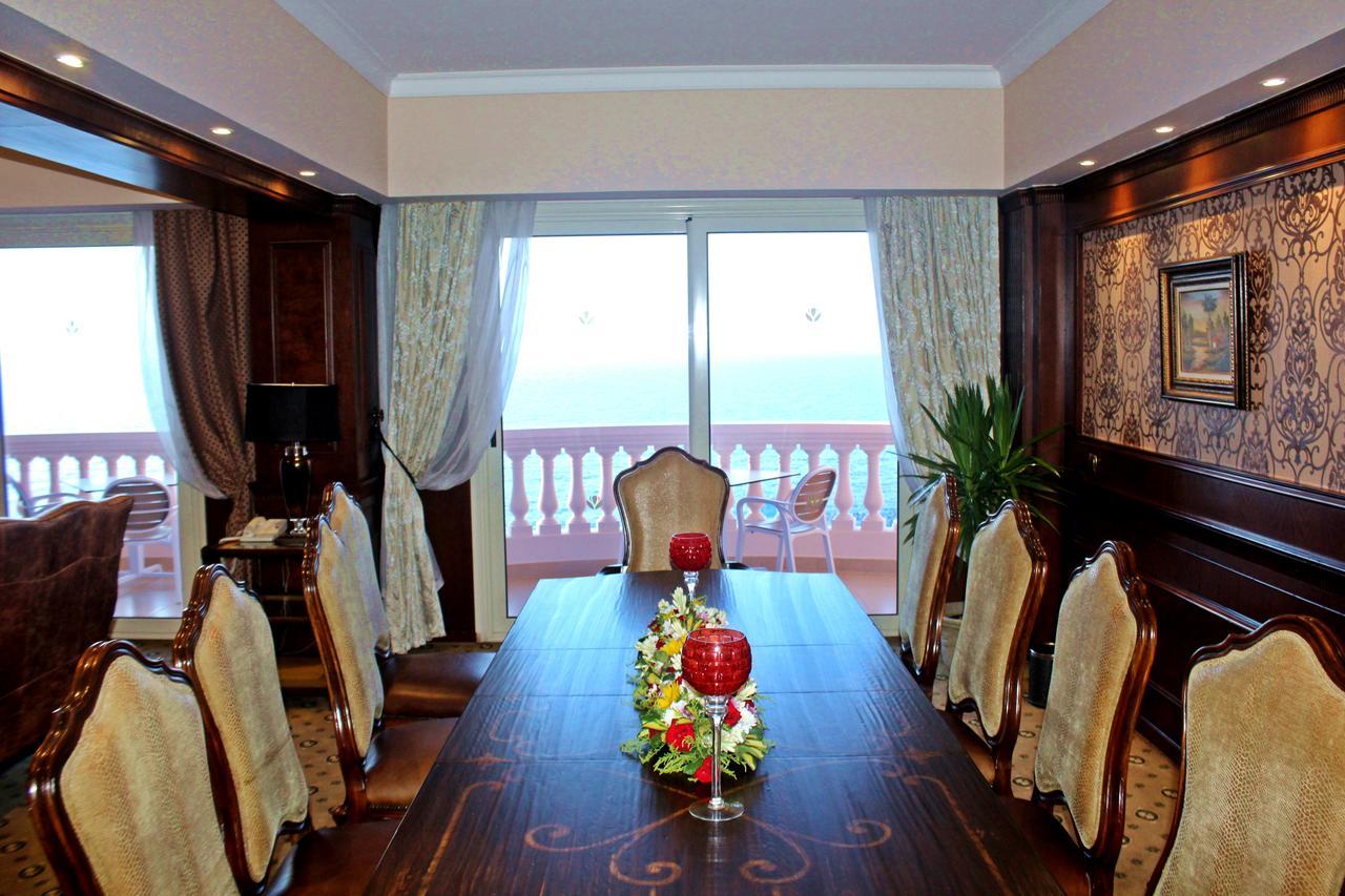 Tolip Hotel Alexandria Bagian luar foto The dining room of a suite